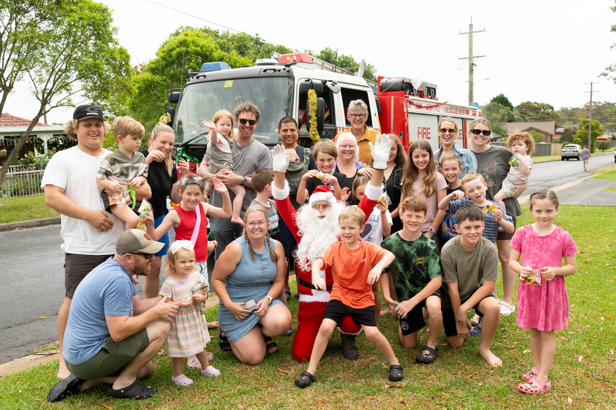 Santa boards big red fire truck for annual Lolly Run 
												post image