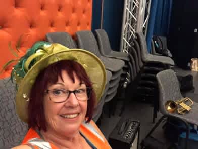 Long-term HONK! Oz volunteer  Anne Steyer on venue door duty at the Wollongong Town Hall.