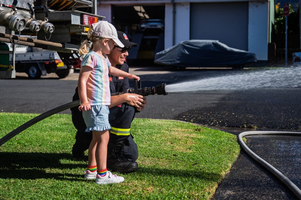 Visitors seize chance to hold a hose at NSW Fire and Rescue Open Day post image
