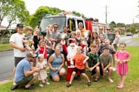 Santa boards big red fire truck for annual Lolly Run post image